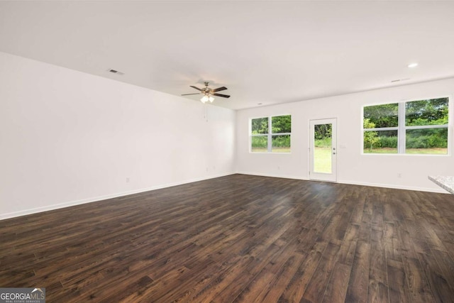 empty room featuring dark hardwood / wood-style floors and ceiling fan