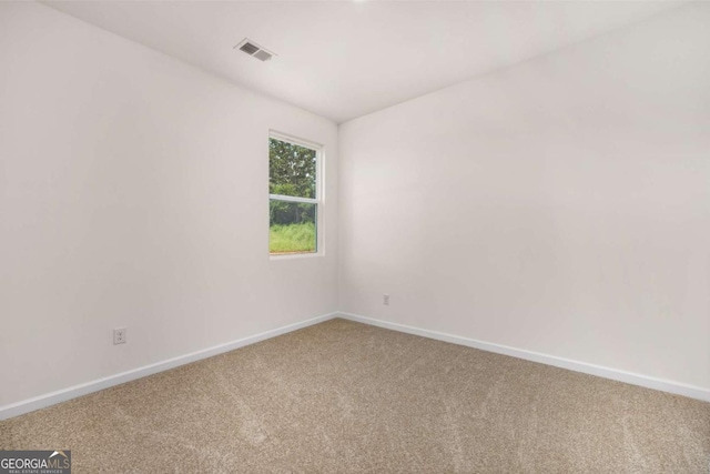 unfurnished room featuring carpet flooring