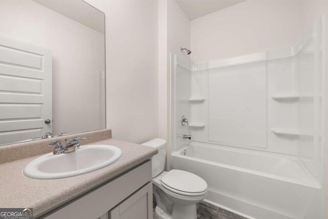 full bathroom featuring vanity, toilet, and shower / tub combination