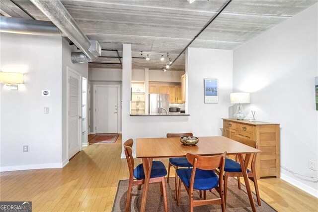 dining room with light wood-type flooring