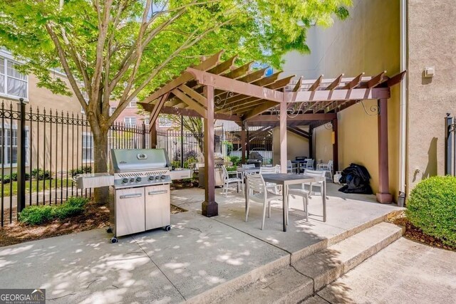 view of patio / terrace featuring a grill and a pergola