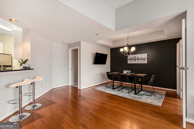 living room featuring hardwood / wood-style floors, a textured ceiling, and ceiling fan