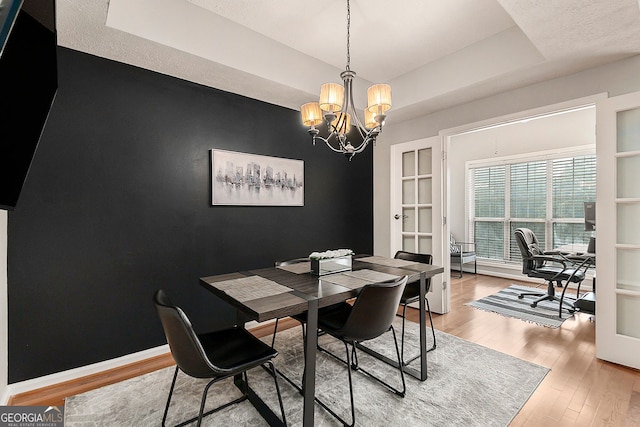 living room featuring hardwood / wood-style flooring, a textured ceiling, and ceiling fan