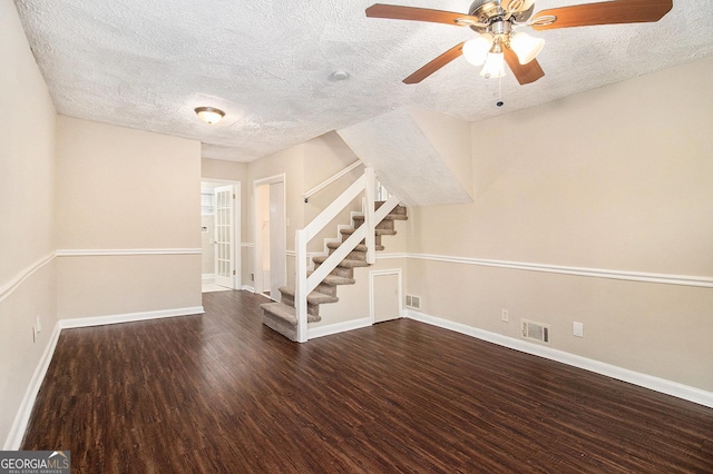 interior space with hardwood / wood-style flooring, ceiling fan, and a textured ceiling