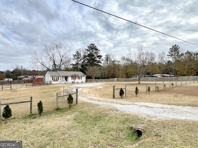 view of yard with a rural view