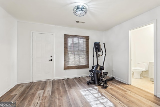 workout room featuring hardwood / wood-style floors