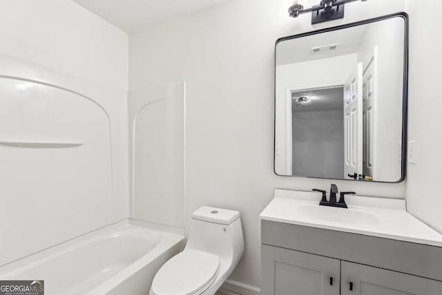 full bathroom featuring vanity, bathing tub / shower combination, and toilet