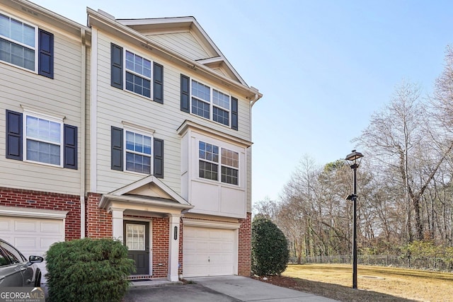 townhome / multi-family property featuring a garage