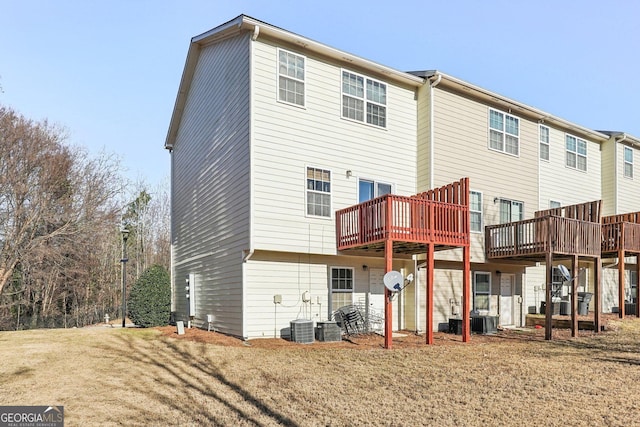 back of house featuring a deck and central air condition unit