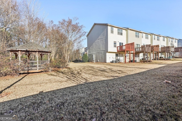 view of yard featuring a gazebo and a wooden deck