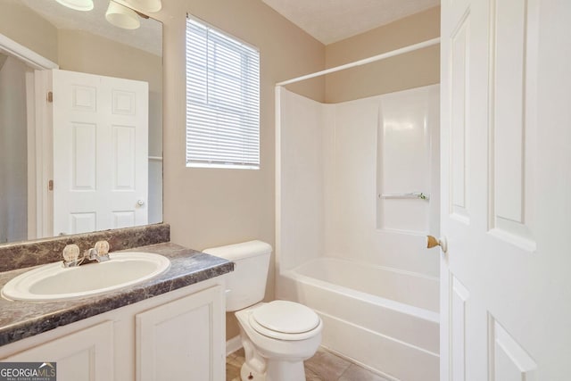 full bathroom featuring shower / washtub combination, vanity, a textured ceiling, tile patterned floors, and toilet