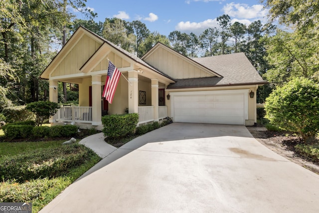 view of front of home with a porch and a garage