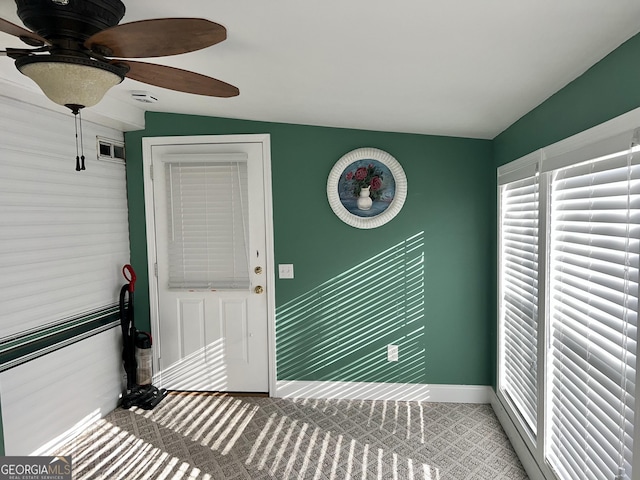 property entrance featuring ceiling fan