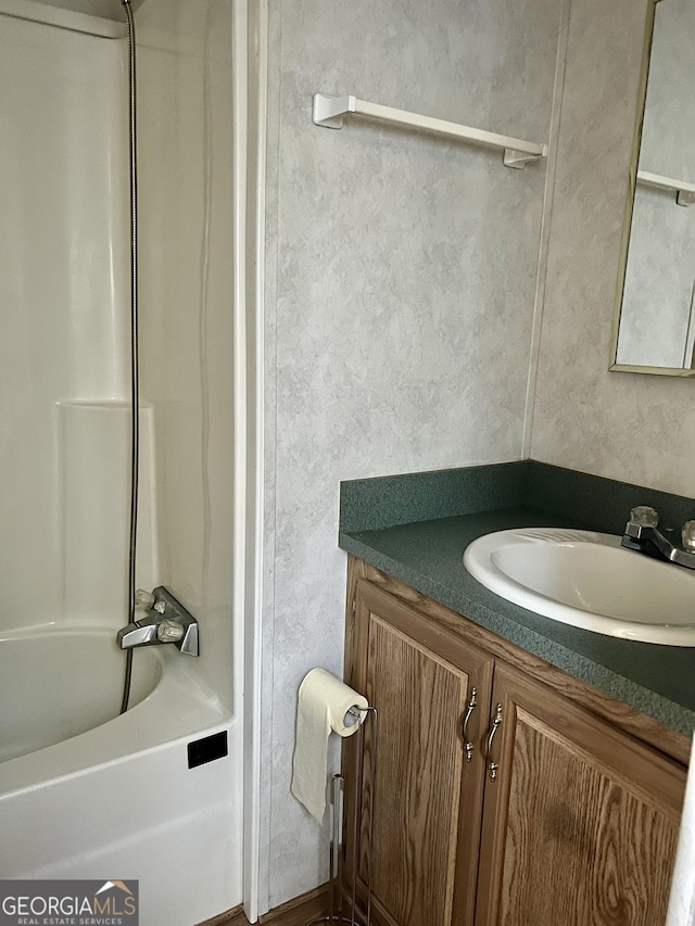 bathroom with vanity and shower / bath combination