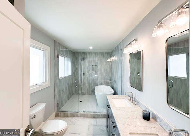 full bathroom featuring vanity, separate shower and tub, toilet, and tile patterned flooring