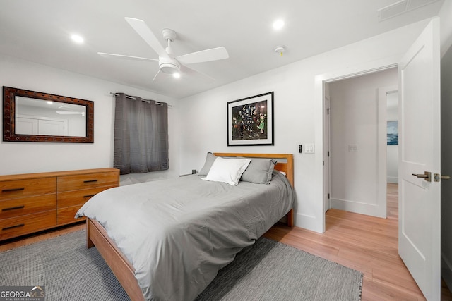 bedroom featuring light hardwood / wood-style flooring and ceiling fan