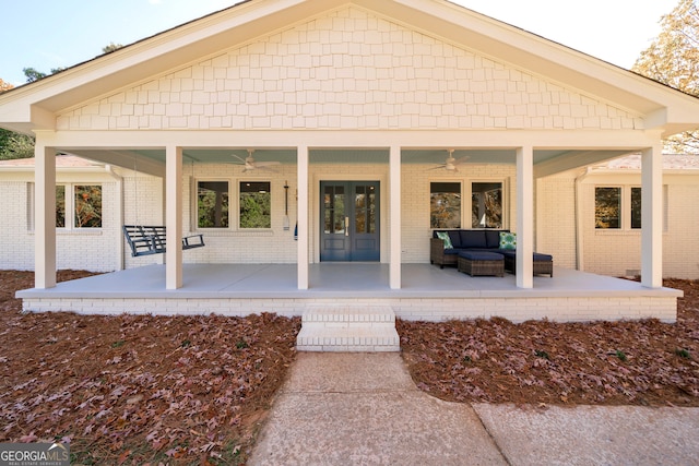 rear view of property with ceiling fan and an outdoor hangout area