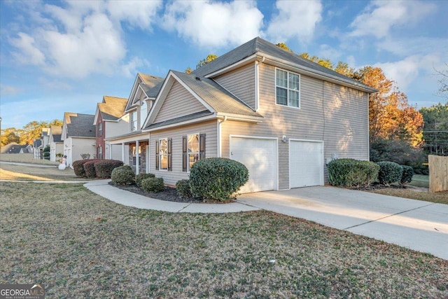 view of home's exterior with a yard and a garage