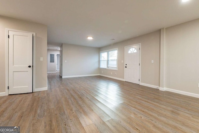 entrance foyer featuring light hardwood / wood-style floors