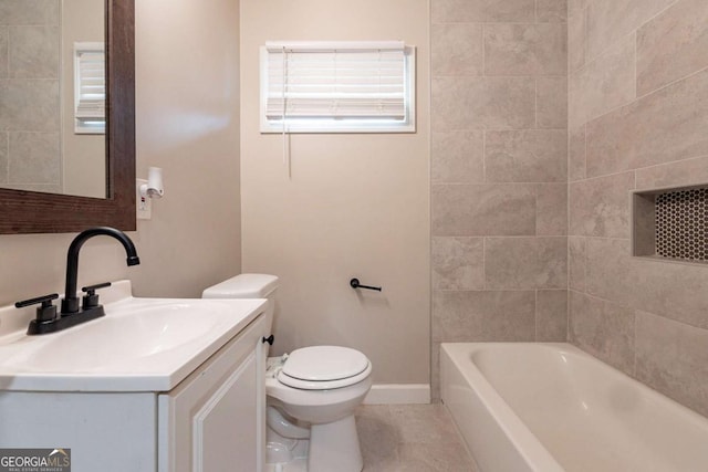 full bathroom with tile patterned flooring, vanity, toilet, and tiled shower / bath combo