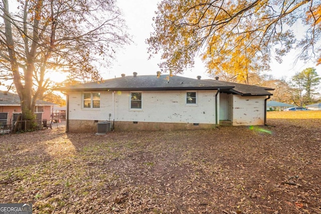 rear view of house with central air condition unit