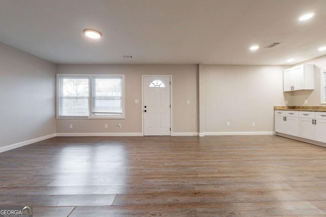 unfurnished living room featuring light hardwood / wood-style floors