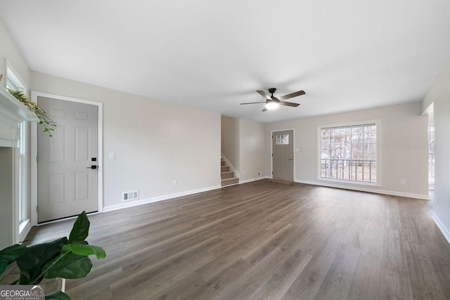 unfurnished living room with ceiling fan and wood-type flooring