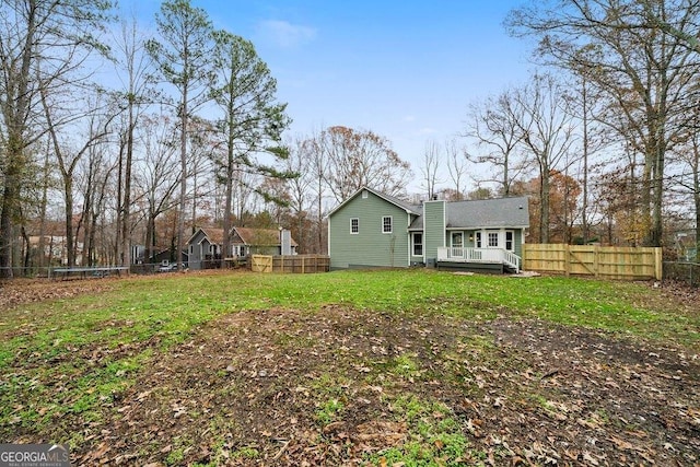 back of property featuring a deck