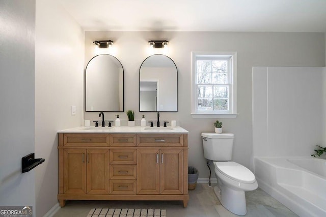 bathroom featuring vanity and toilet