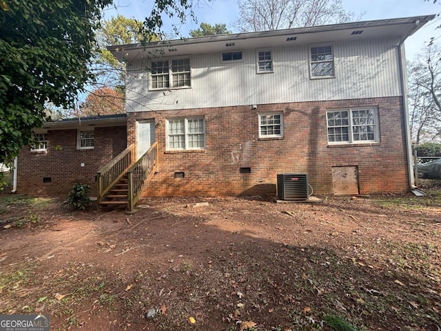 rear view of property featuring central AC unit