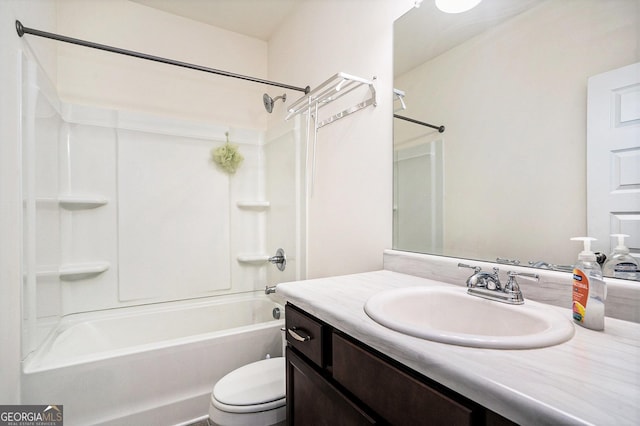 full bathroom featuring washtub / shower combination, vanity, and toilet