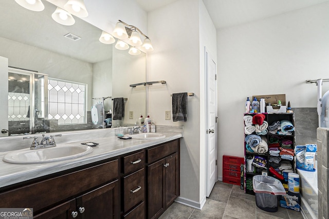 bathroom featuring vanity and an enclosed shower