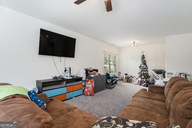 carpeted living room with ceiling fan