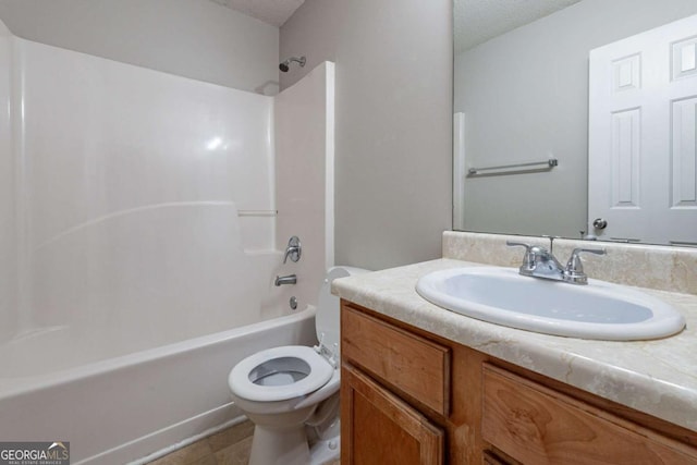 full bathroom with vanity, a textured ceiling, toilet, and tub / shower combination