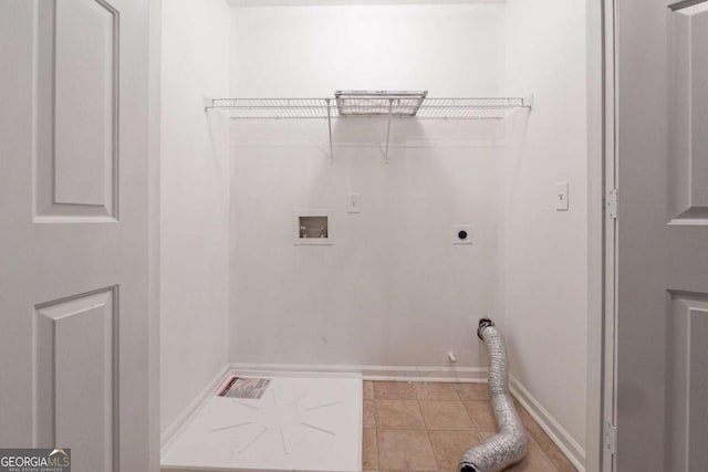 washroom with washer hookup, light tile patterned floors, gas dryer hookup, and electric dryer hookup