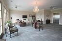 dining room with healthy amount of natural light, a chandelier, and finished concrete flooring