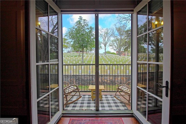 doorway featuring wood finished floors