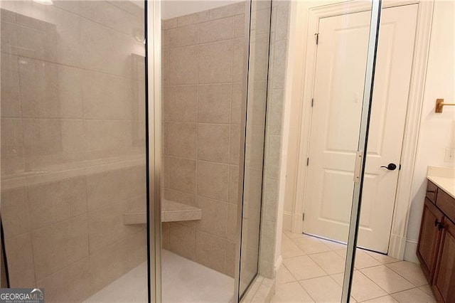 bathroom with vanity, a stall shower, and tile patterned flooring