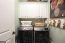 laundry area with cabinet space and washer and clothes dryer