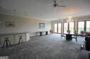 living area with ceiling fan