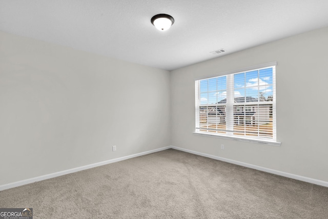 spare room featuring carpet flooring