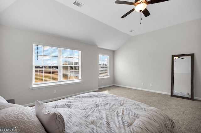 bedroom with carpet, vaulted ceiling, and ceiling fan