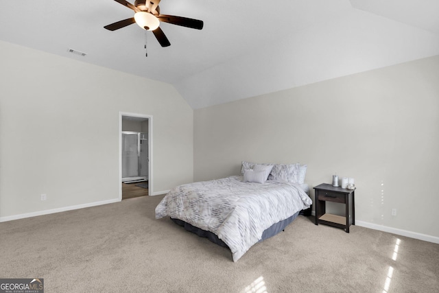 carpeted bedroom featuring ceiling fan, connected bathroom, and vaulted ceiling