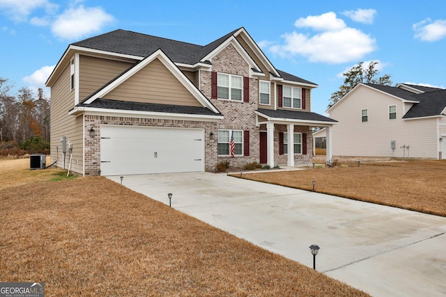 craftsman-style house featuring a garage, a front lawn, and central air condition unit