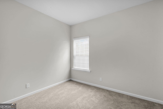 unfurnished room featuring carpet flooring