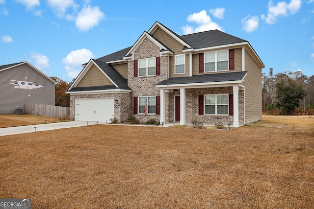 view of front of home with central air condition unit and a front lawn