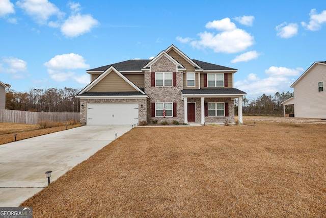 craftsman-style home with a garage and a front lawn