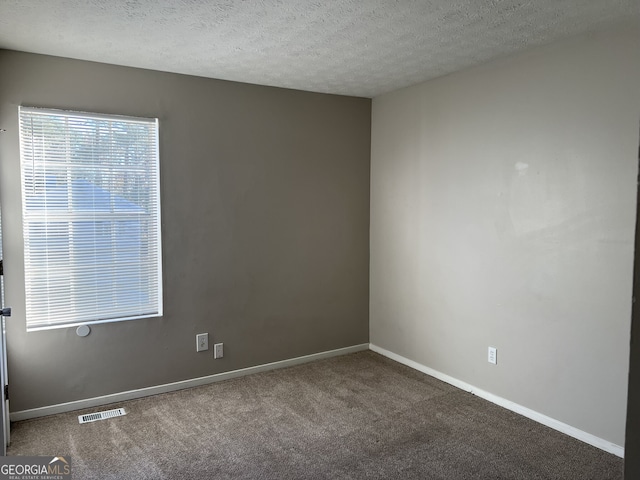 6268 Marbut Farms Trl, Lithonia, GA 30058 - spare room featuring carpet flooring and a textured ceiling