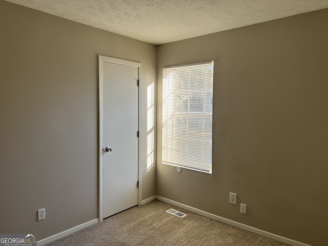 6268 Marbut Farms Trl, Lithonia, GA 30058 - unfurnished room featuring carpet and a textured ceiling