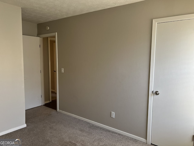 6268 Marbut Farms Trl, Lithonia, GA 30058 - carpeted empty room featuring a textured ceiling and baseboards